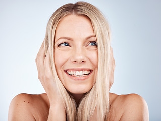 Image showing Hair, woman and blond lady with aesthetic haircare on a grey studio background for health and wellness. Blonde woman, blond hair and cosmetic wellness for hair care, hairstyle and healthy hair