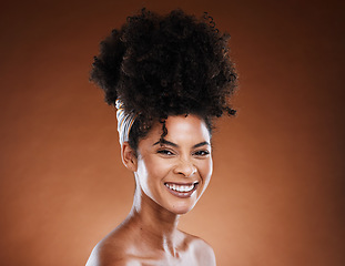 Image showing Black woman, afro hair and cosmetic studio with smile on face for self care, hair care and beauty. Woman, cosmetics model with natural african hairstyle, makeup and wellness by brown background