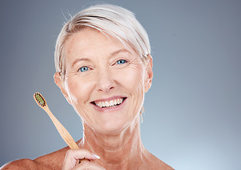 Image showing Dental, toothbrush and portrait of senior woman with teeth hygiene, wellness and health in studio. Cosmetic, clean and happy elderly woman with oral care to prevent cavity isolated by gray background