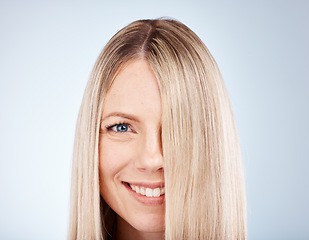 Image showing Hair care, smile and portrait of a woman with straight hair against a grey studio background. Wellness, luxury and face of a happy, blonde and beauty model with healthy, clean and beautiful long hair