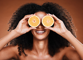 Image showing Beauty, skincare and black woman with orange product for cosmetics healthcare, organic and vitamin c treatment. Fruit for skin health, healthy diet and nutrition lifestyle model on studio background