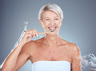 Image showing Toothbrush, portrait and senior woman dental healthcare studio mockup brushing teeth for dentist and whitening advertising. Smile of elderly model mouth with breath fresh toothpaste and water splash