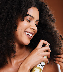 Image showing beauty, afro and black woman with hair care spray for hairstyle maintenance, shine and protection. Spa salon product, wellness and face of model with hairspray bottle for clean healthy hair growth