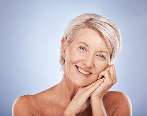 Image showing Face portrait, makeup and senior woman in studio isolated on blue background. Skincare, beauty cosmetics or elderly female model from Australia happy for glowing and healthy skin after facial