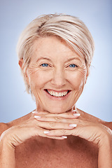 Image showing Skincare, wellness and portrait of senior woman with smile on blue background in studio. Beauty, makeup and face of old woman with natural skin pose for dermatology, body care and antiaging cosmetics