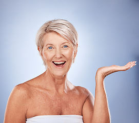 Image showing Portrait of elderly woman, beauty and skincare product advertising or marketing mockup with face of Finland wellness model on gray studio background. Happy smile, natural skin and organic facial spa