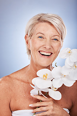 Image showing Mature woman, portrait and beauty with a flower for organic or natural skincare and bodycare. Face, senior female and floral cosmetology or dermatology treatment for facial antiaging wellness