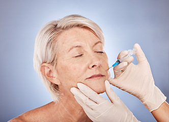 Image showing Plastic surgery, injection and senior woman with hands of doctor for medical beauty against grey studio background. Skincare, wellness and elderly patient with needle for facial lifting and cosmetics