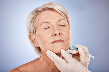 Image showing Syringe, doctor hands and senior woman face for collagen, skincare and antiaging filler injection with medical cosmetics in studio. Elderly woman model and dermatology expert for plastic surgery.