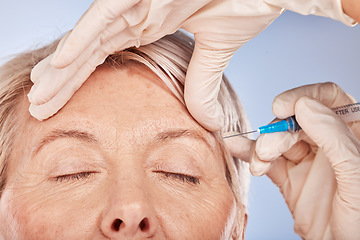 Image showing Face, hand and syringe for needle, cosmetic and beauty against a grey studio back with mockup, Senior woman with plastic surgery, hands and facial for collagen, lifting and silicone injection.