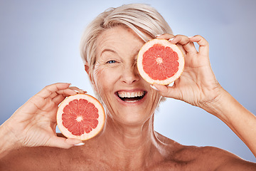 Image showing Grapefruit, portrait of happy senior woman in studio or natural skincare product for vegetarian lifestyle. Detox diet for retirement, elderly healthcare nutritionist on gray background or clean face