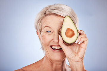 Image showing Skincare, avocado and senior woman with smile, natural beauty and confident against grey studio background. Cosmetics, mature female and elderly lady with avo for facial oils for wellness and health