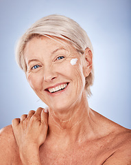 Image showing Cream, skincare and portrait of senior woman in studio for cosmetics, beauty and face wellness promotion, marketing and advertising space. Elderly model facial sunscreen for dermatology or antiaging