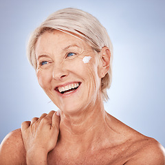 Image showing Facial cream, mature woman and skincare lotion, sunscreen and makeup, beauty and anti aging dermatology on studio background. Happy senior lady model, face cream and cosmetics, body care and wellness