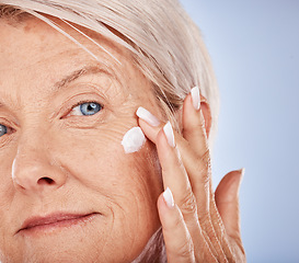 Image showing Senior, skincare and face wellness cream of a woman with cosmetic, beauty and facial product. Portrait of a elderly model with sunscreen, cosmetics and collagen dermatology lotion for anti aging