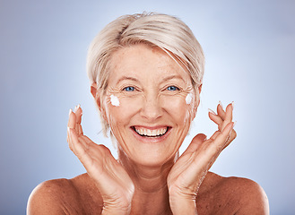 Image showing Senior woman, face and skincare cream product for grooming on studio background in dermatology routine, health wellness or collagen treatment. Happy smile or elderly beauty model and sunscreen facial