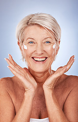 Image showing Beauty, portrait of mature woman and cream for skincare, anti aging and wellness on a grey studio background. Skin care, moisturiser or lotion with a senior female apply suncream or spf on her face