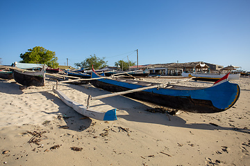 Image showing Traditional wooden fishing boats on the tropical beach of Anakao, Tulear, Madagascar. Ocean view with sandy beach