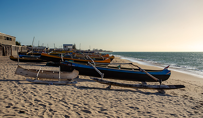 Image showing Traditional wooden fishing boats on the tropical beach of Anakao, Tulear, Madagascar. Ocean view with sandy beach