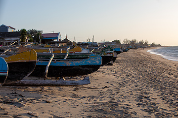 Image showing Traditional wooden fishing boats on the tropical beach of Anakao, Tulear, Madagascar. Ocean view with sandy beach