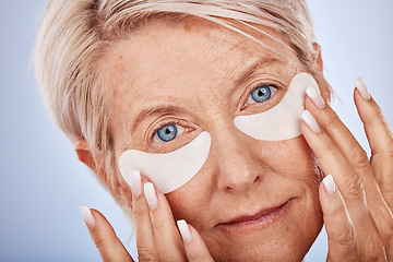 Image showing Skincare, portrait and senior woman with eyepads on face for anti aging facial on studio background. Beauty, cosmetics and mature lady with collagen mask or eye patches for wrinkles and eye wellness.