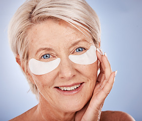 Image showing Mature woman, face and eye patch for skincare grooming routine, anti aging treatment or dark circles collagen boost. Zoom, portrait and happy smile on middle aged beauty model with eye facial product