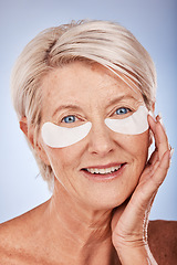 Image showing Skincare, beauty and senior woman with patches for eyes, wellness and cosmetics against a grey studio background. Spa, luxury and elderly model with a facial product for body care, wrinkles and aging