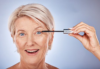 Image showing Portrait of senior woman with mascara brush, cosmetic beauty product and makeup wand for eye lashes in Sydney. Surprised smile in studio with gray background, natural blue eyes and luxury skincare