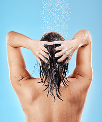 Image showing Beauty, skincare and haircare, woman in shower from back on blue background, shampoo and hygiene routine in morning. Healthy model in water cleaning hair with running water for clean fresh lifestyle.