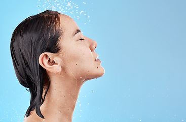 Image showing Heath, hair and woman in shower on blue background with mockup, advertising or product placement space. Haircare, water and skincare, hygiene routine in the morning asian woman with clean lifestyle.