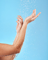 Image showing Hand, shower and water with a woman cleansing her body for skincare, bodycare and washing. Hygiene, grooming and showering female arm for health, wellness and skin care, body care and hydration