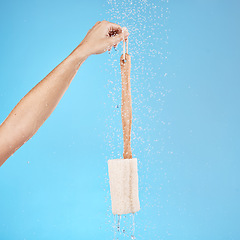 Image showing Shower, back brush and body loofah of cleaning, skincare massage or hygiene on studio blue background. Woman hands, water splash and bath sponge, wellness and eco bamboo beauty product for clean skin