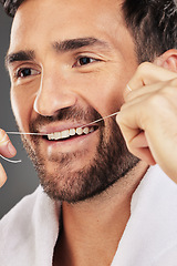 Image showing Man, teeth and face smile for dental floss, skincare or cosmetics for fresh clean or healthy hygiene. Closeup of bearded male flossing toothy mouth for oral, dermatology or gum care treatment