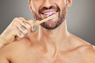 Image showing Man, mouth and toothbrush for dental care, hygiene and health on with a brush on a grey studio background. Oral care, healthy teeth and dental wellbeing or cleansing or clean grooming routine