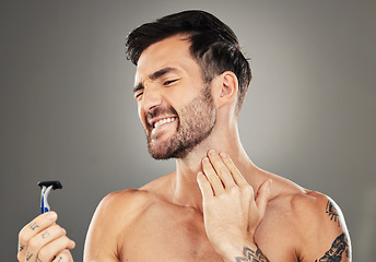 Image showing Man, face and shaving pain on neck for skincare beauty or cosmetics wellness in studio. Facial care, hygiene dermatology grooming acciedent and shave beard for skin healthcare against grey background