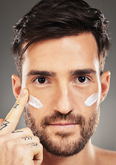 Image showing Portrait of man, skincare and cream product on face for natural skin wellness, cosmetic beauty and skin health in studio. Sunscreen, eye wrinkle protection and organic facial healthcare creme lotion