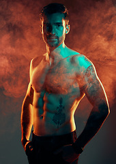 Image showing Fashion, body and smoke with a man model in studio on a gray background with red mist for contemporary style. Fitness, beauty and portrait with a topless young handsome male posing in a smokey haze