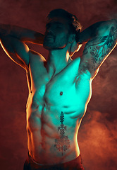 Image showing Beauty, fitness and man with smoke in studio with red lighting for workout motivation. Power, strength and strong male model posing for bodybuilding sports, exercise and training with muscular body