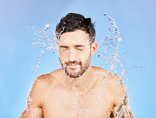 Image showing Water splash, shower and man cleaning, skincare and. washing body, face and beauty in blue stuck mockup background. Male model, clean, and hygiene care, fresh and wash skin for health and wellness