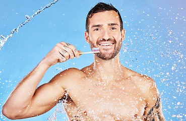 Image showing Man, toothbrush and smile for dental care, hygiene and cosmetics against an aqua blue studio background. Portrait of happy male smiling with teeth for clean oral wash, mouth or gum care treatment