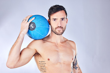 Image showing Man, basketball and sport with ball, tattoo and body against a grey studio background with mockup space. Male model, athlete and sports person with portrait, training and fitness after game practice