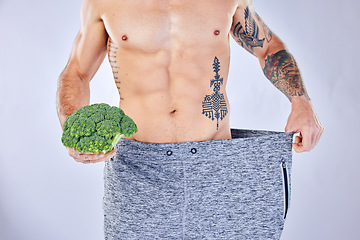 Image showing Vegetable, diet and weight loss, man on health detox and workout exercise for healthy lifestyle on studio background. Fitness, nutrition and wellness for balance in body, male model with tattoo.