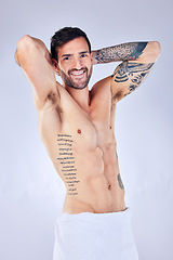 Image showing Man, fitness body or shower towel on gray studio background and workout, training and exercise muscle growth check. Portrait, smile or happy model personal trainer or coach flexing abs in sauna cloth