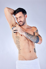 Image showing Shaving, armpit hair removal and man with shaver for grooming and clean against studio background. Hygiene, beauty and cleaning body for epilation and wellness, skin and skincare mockup.