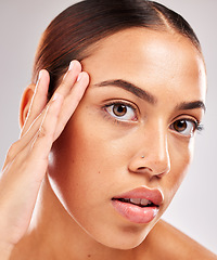 Image showing Skincare, health and headshot portrait of a woman with a wellness, natural and face routine in a studio. Beauty, cosmetics and girl model from Brazil with healthy skin isolated by a gray background.