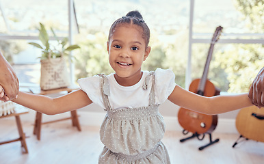 Image showing Girl in living room, portrait of kid holding hands for family support in child care or learning trust in Mexico home. Happy young kindergartener with smile on face, apartment lounge or kids happiness