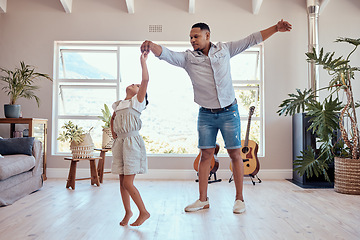 Image showing Father, daughter and dancing in living room family home with energy, freedom and fun, relax and happy lifestyle together. Dad, girl kid and happy family spinning dance to music, bonding and happiness