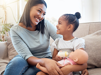 Image showing Home, mother and child with doll playing on sofa having fun, bonding and enjoying weekend. Family, love and mom sitting with young girl with toys on couch for quality time, holiday and happy together