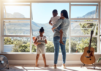 Image showing Child, window and view with mother and brother while holding her doll at home. Little girl, woman and siblings with parent looking at while bonding and relaxing with mom in the family home with love