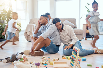 Image showing Tired parents, children playing in living room and running in with adhd energy, burnout parents and happy kids run for crazy fun. Child development, growing up and play in lounge family home together